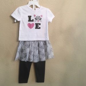 2 piece shirt & kitten skirt over  pants.